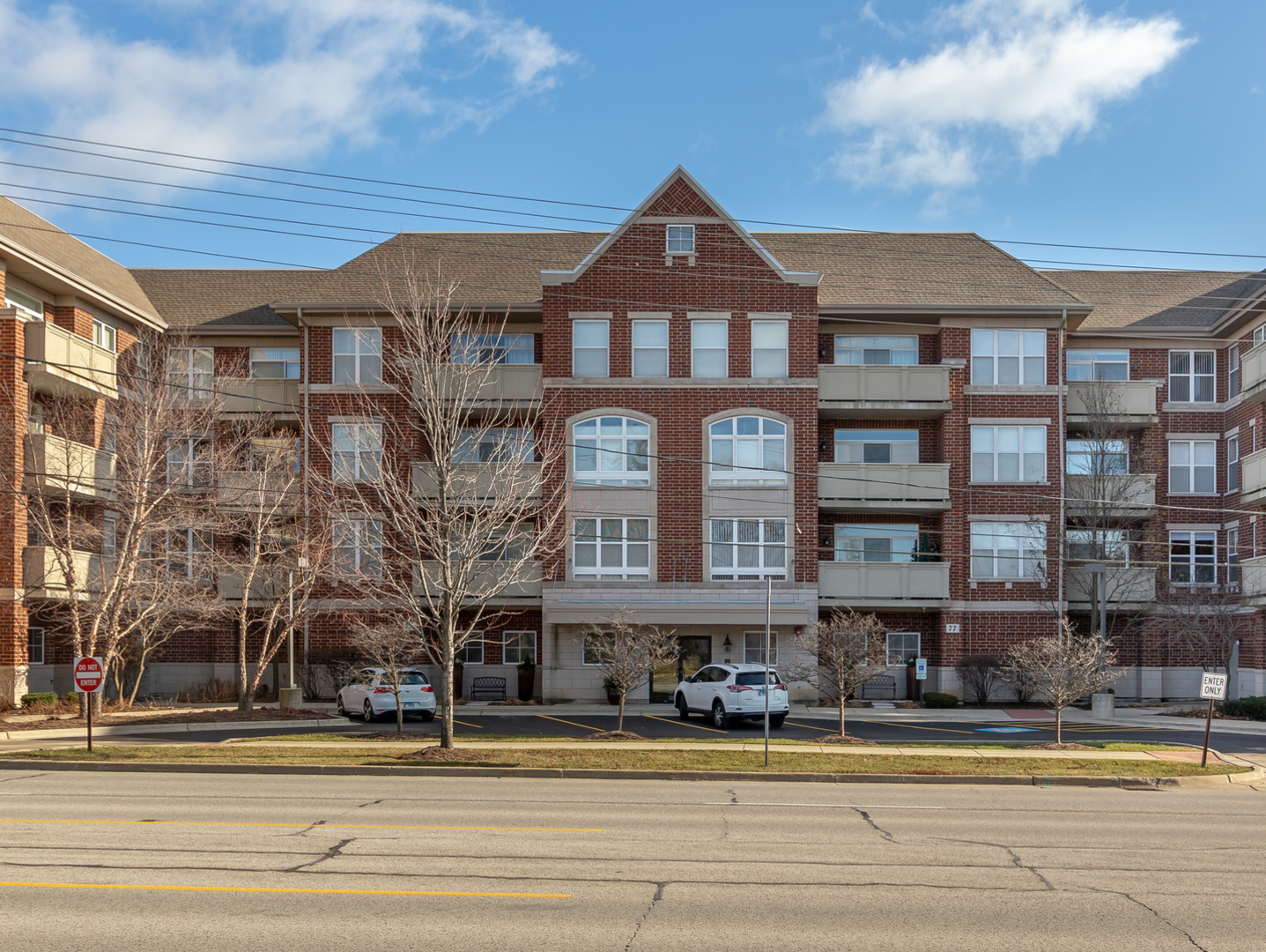 77 North Quentin Road, Unit 402 Palatine, IL 60067 - Photo 1 of 20 a front view of a building