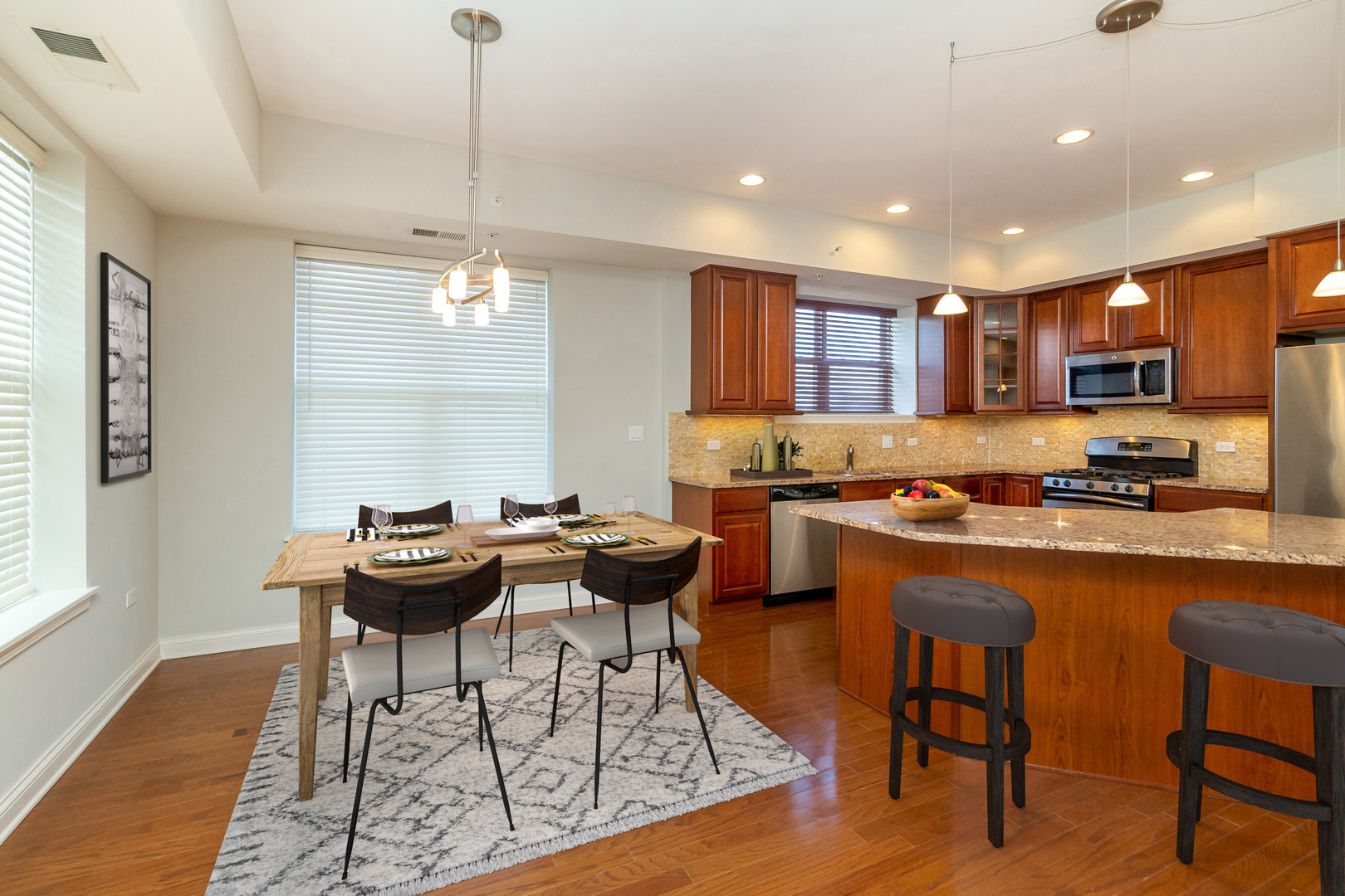77 North Quentin Road, Unit 402 Palatine, IL 60067 - Photo 2 of 20 a kitchen with a dining table and chairs