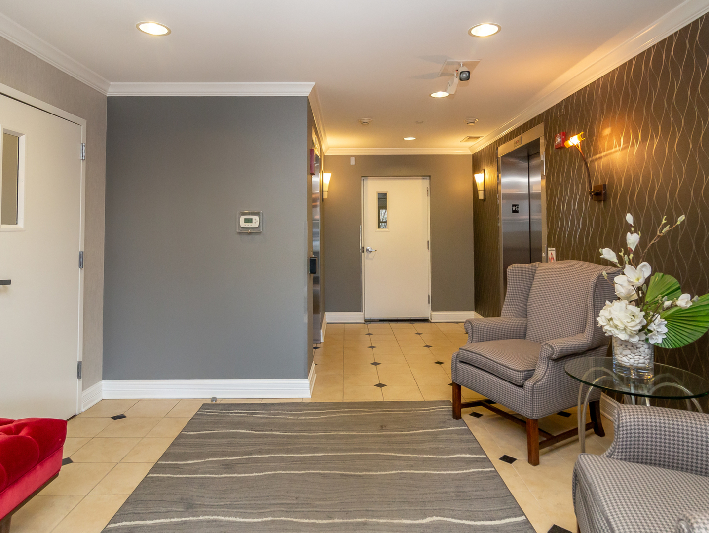77 North Quentin Road, Unit 402 Palatine, IL 60067 - Photo 13 of 20 a spacious bedroom with a bed and a couch