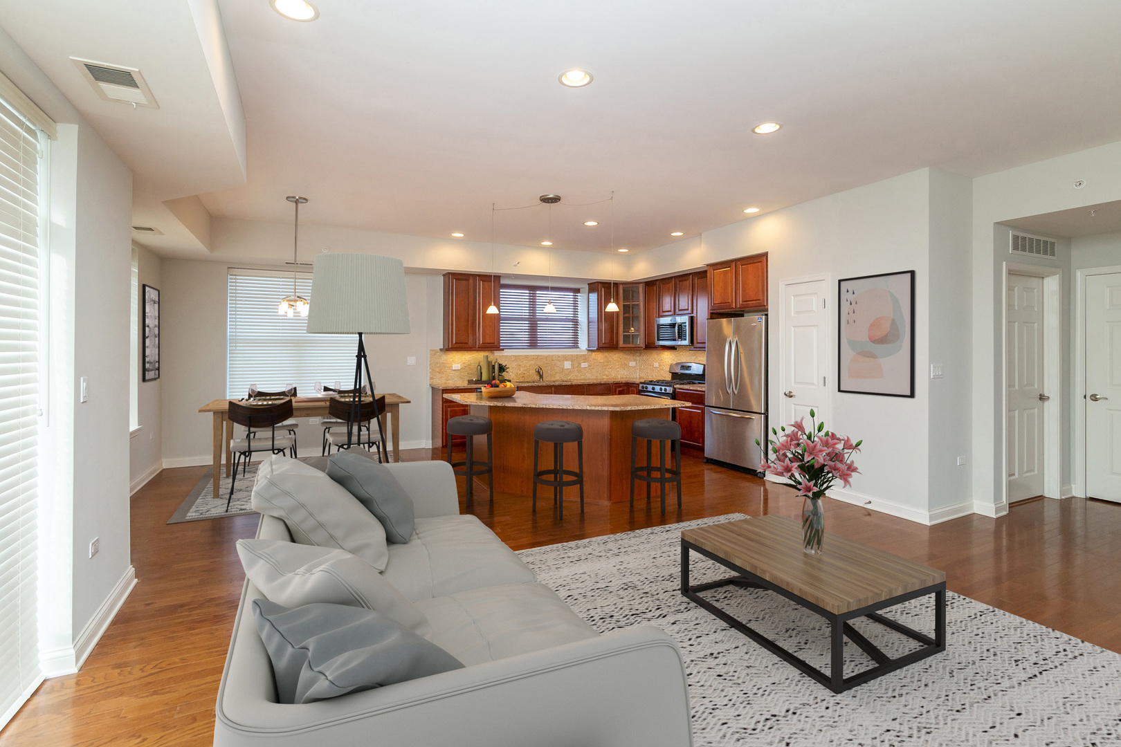 77 North Quentin Road, Unit 402 Palatine, IL 60067 - Photo 3 of 20 a living room with kitchen island furniture and a kitchen view