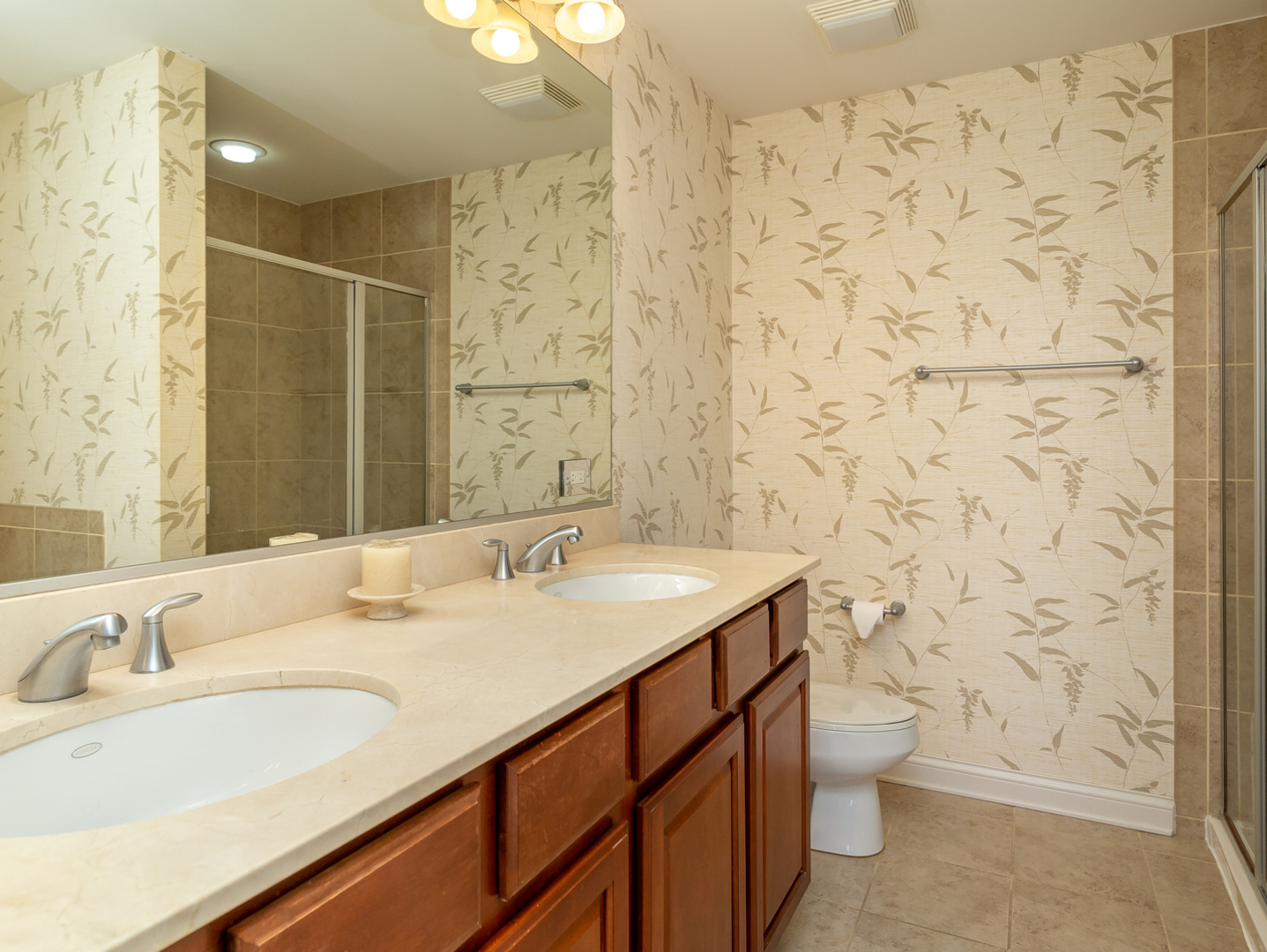77 North Quentin Road, Unit 402 Palatine, IL 60067 - Photo 6 of 20 a bathroom with a sink toilet and shower
