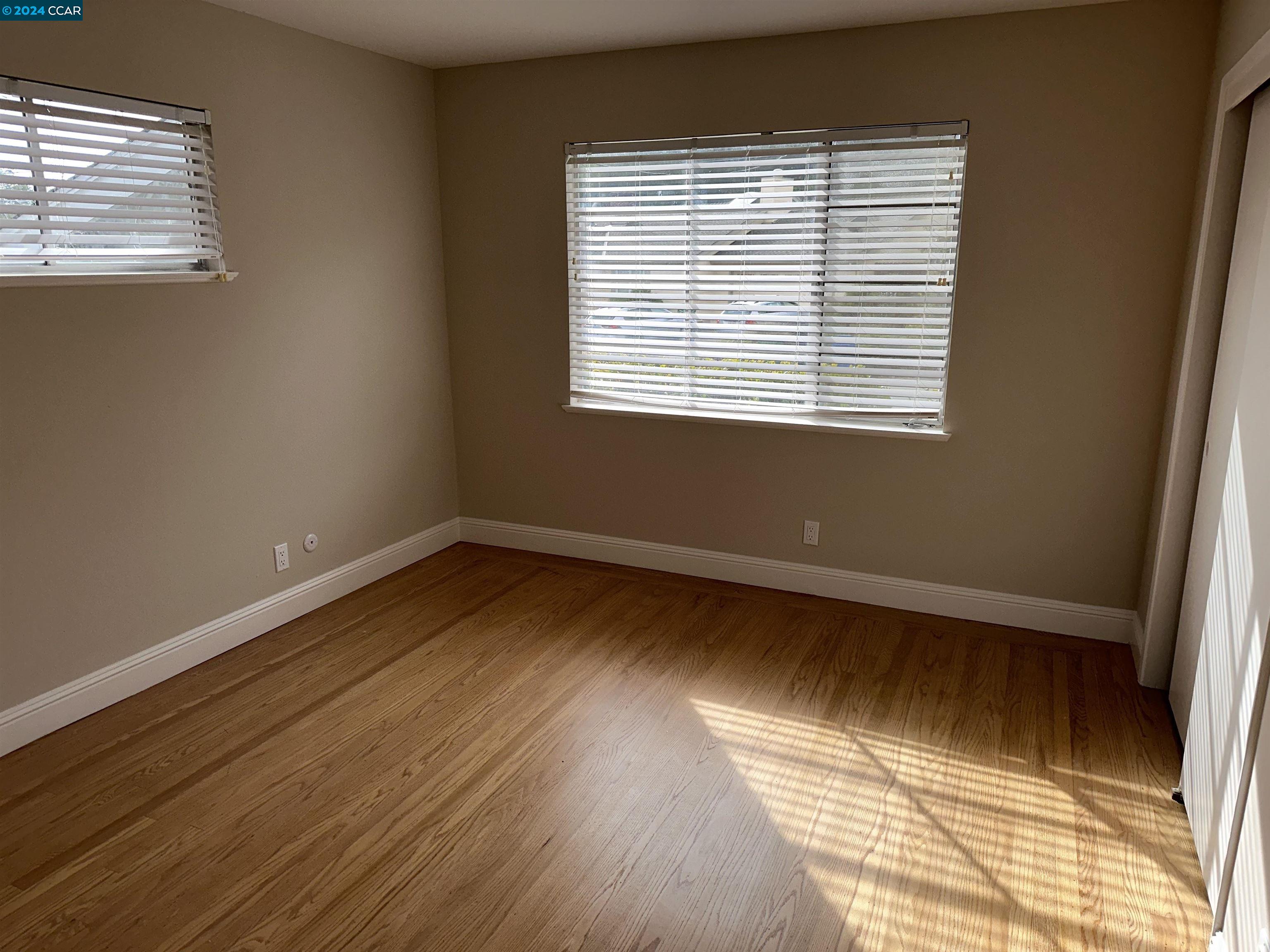 44 Lynwood Place Moraga, CA 94556 - Photo 13 of 14 a view of an empty room with wooden floor and a window