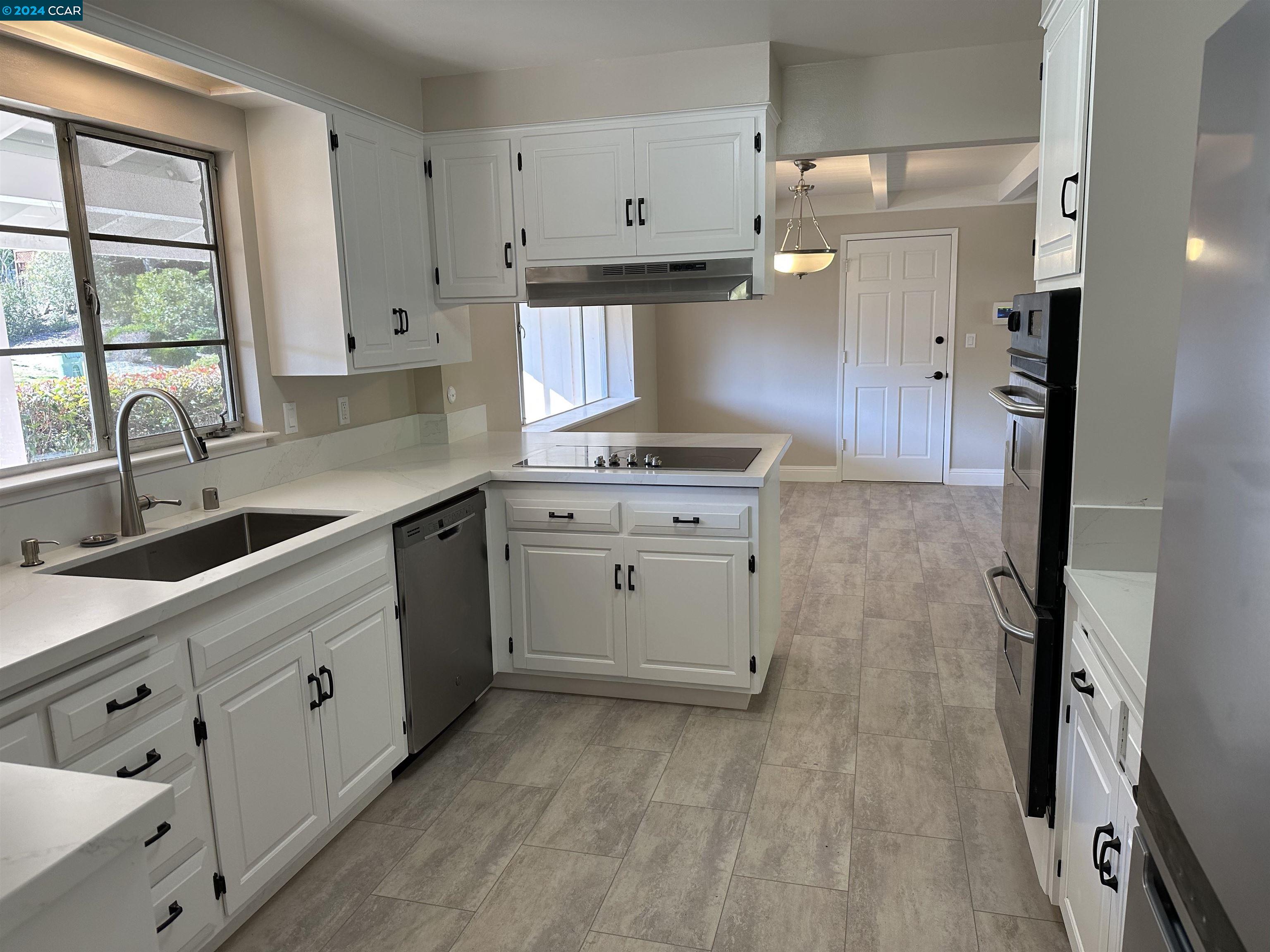 44 Lynwood Place Moraga, CA 94556 - Photo 3 of 14 a kitchen with cabinets appliances and a window