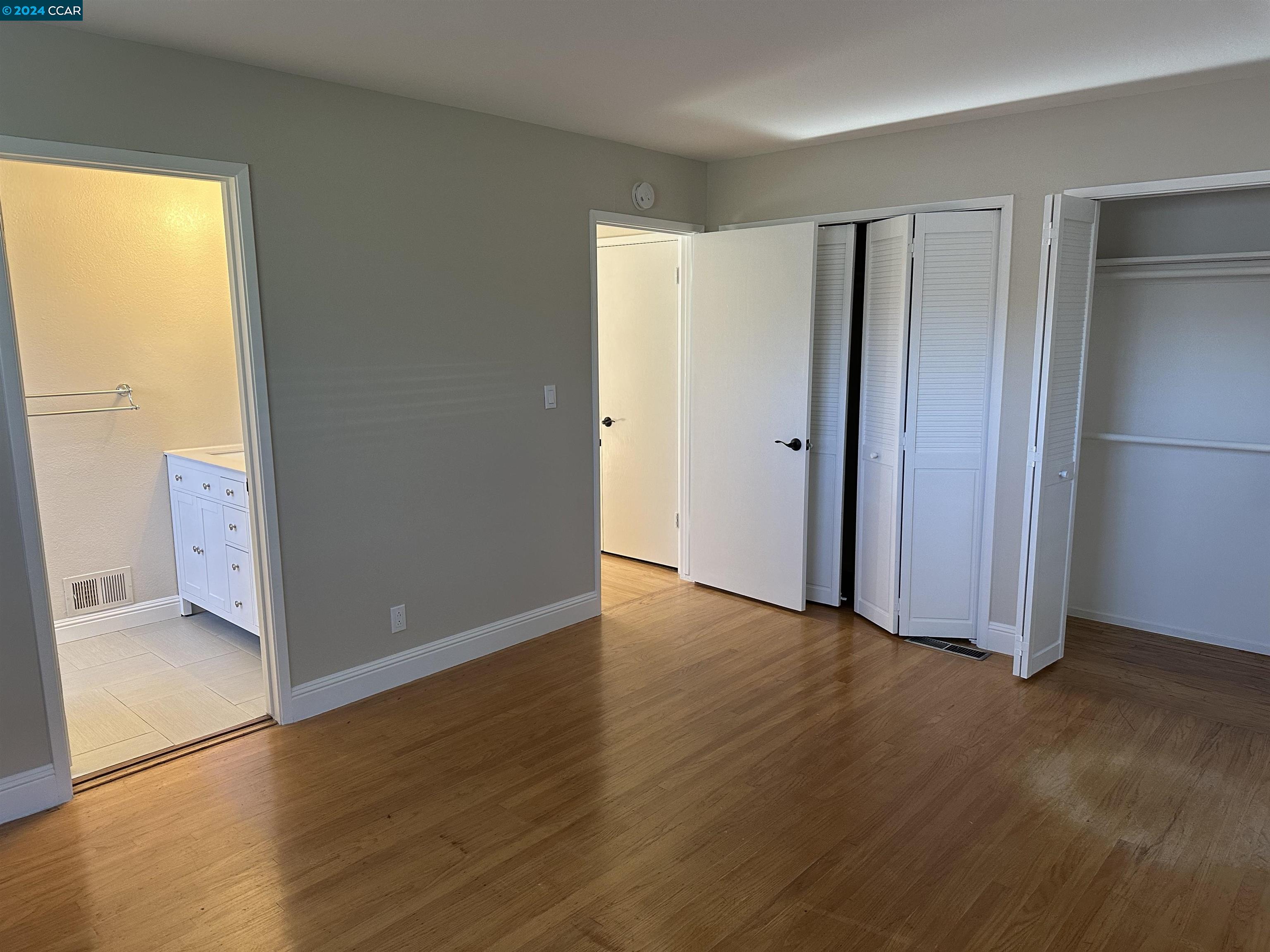 44 Lynwood Place Moraga, CA 94556 - Photo 8 of 14 a view of an empty room with wooden floor and a window