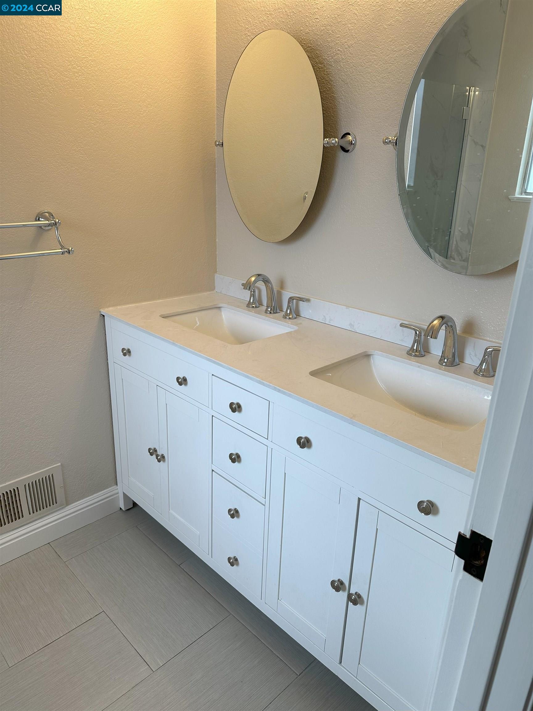 44 Lynwood Place Moraga, CA 94556 - Photo 10 of 14 a bathroom with a double vanity sink and mirror