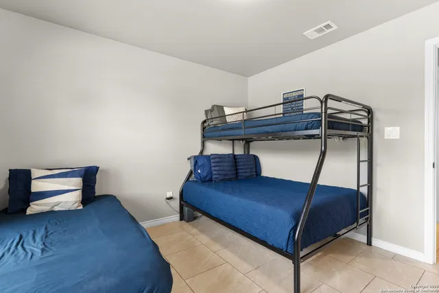 a room with a bed and window