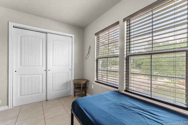 a view of a room with furniture and window