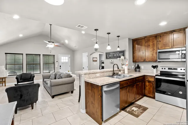 a dining room with furniture and chandelier