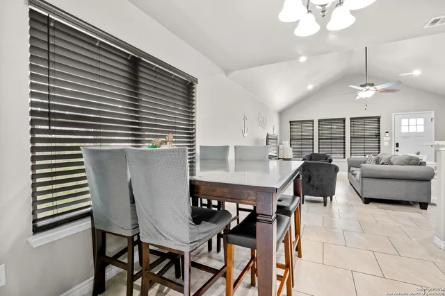 a view of washer and dryer with kitchen in the background