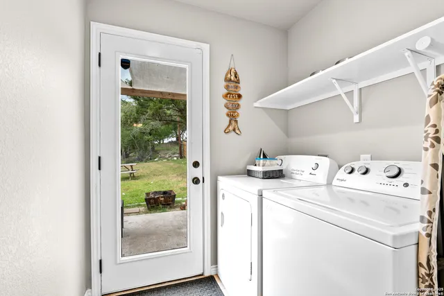 a spacious bedroom with a bed and a table in it