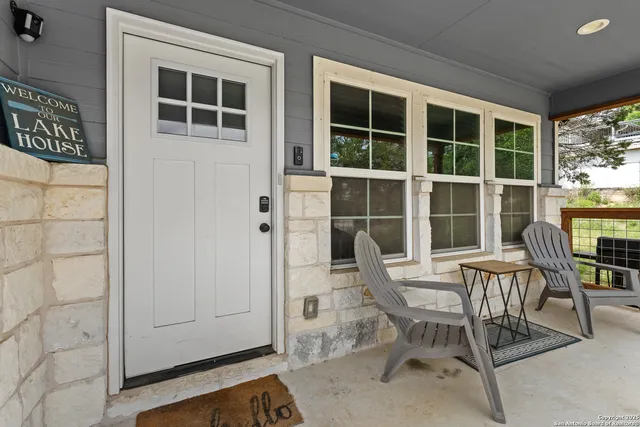 a view of a dining room with furniture and windows