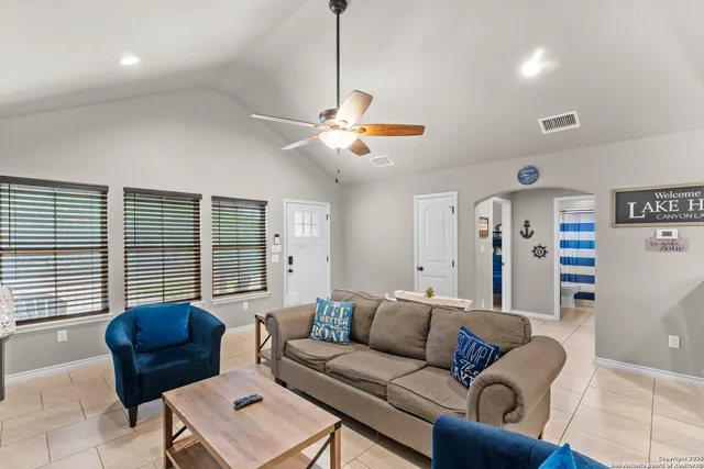 a living room with furniture and a window