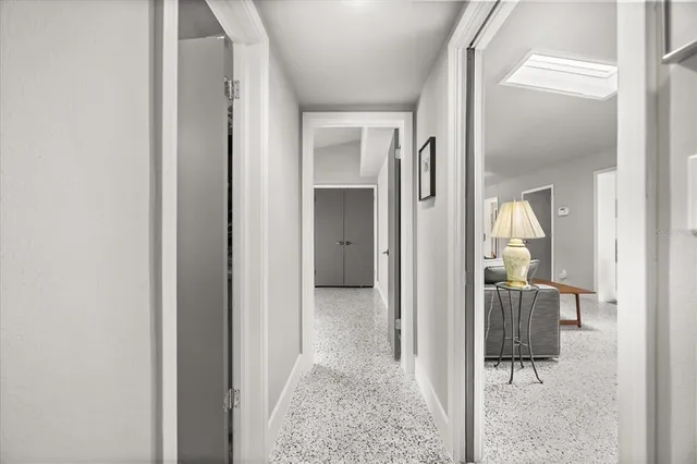 a bathroom with a granite countertop sink a toilet and a mirror