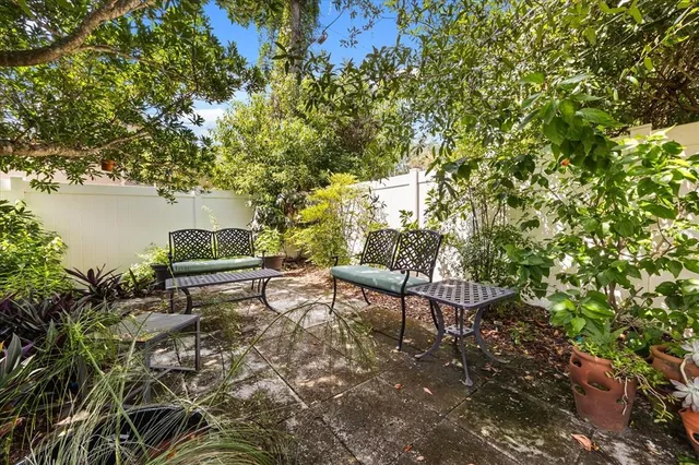 a view of a pathway with a wrought fence