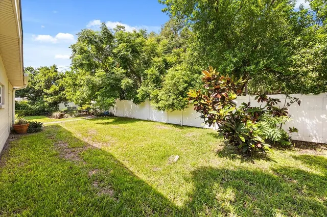an aerial view of a house with a swimming pool