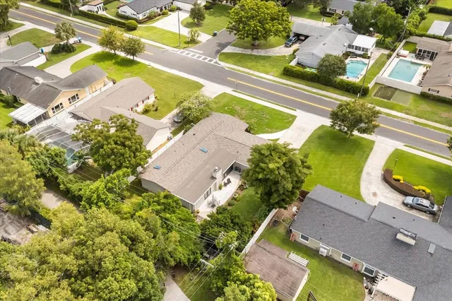 a view of a house with a yard and a garage