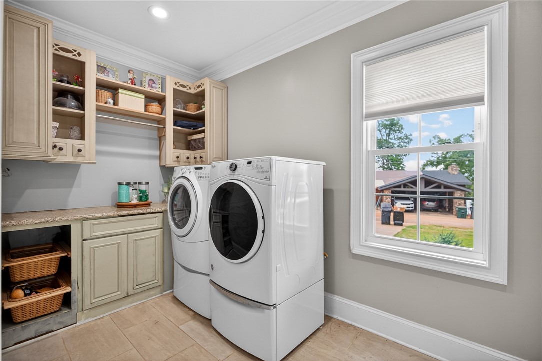 206 James Hare Road Anderson, SC 29626 - Photo 37 of 37 Functional laundry space featuring convenient upper cabinetry and a view to the outdoors.