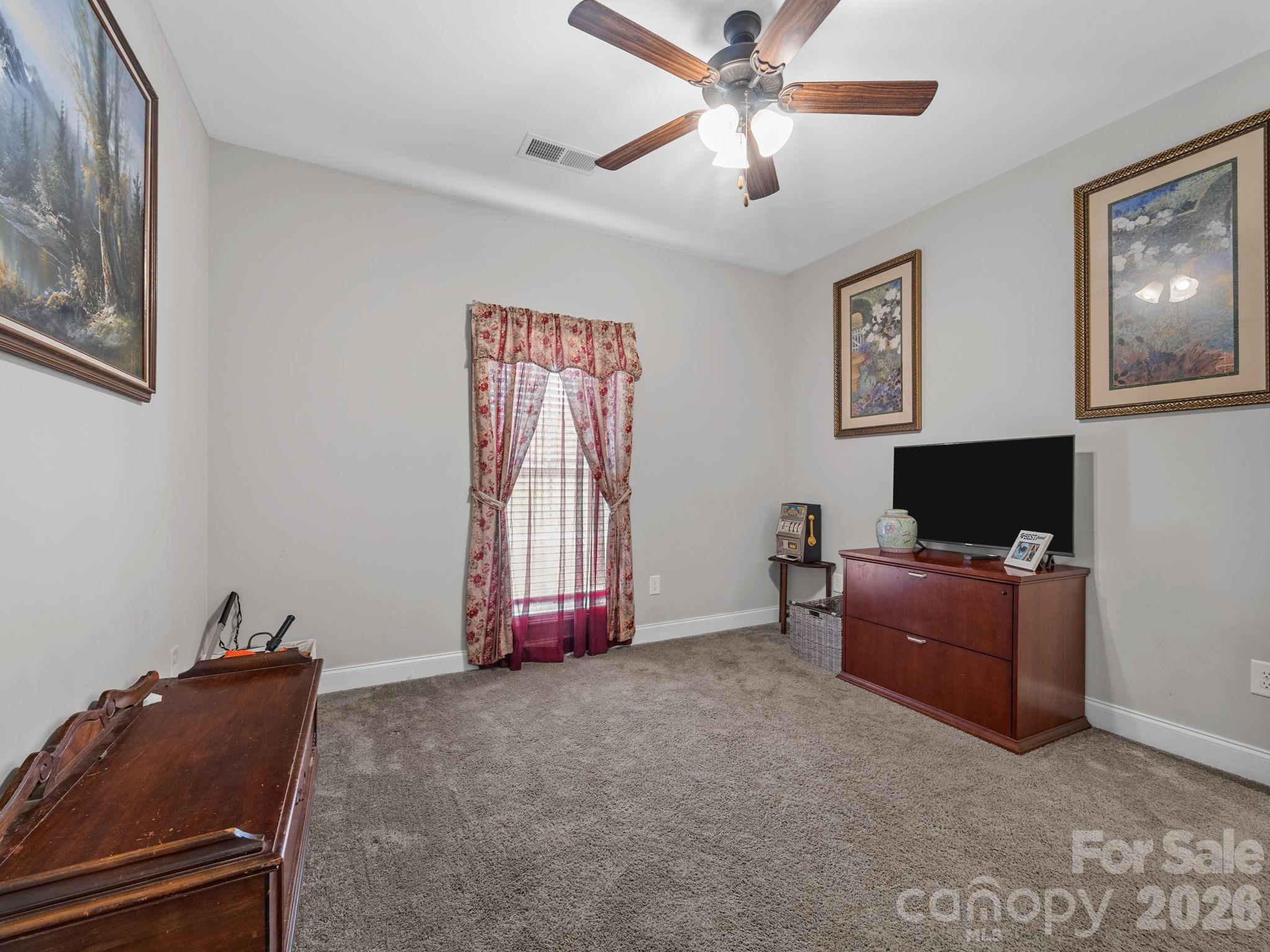 1076 McSwain Road Chesnee, SC 29323 - Photo 25 of 36 a living room with furniture and a flat screen tv