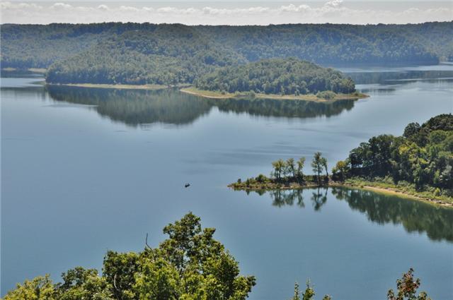 1050 Sunny Point Road Baxter, TN 38544 - Photo 14 of 20 a view of a lake with a mountain in the background