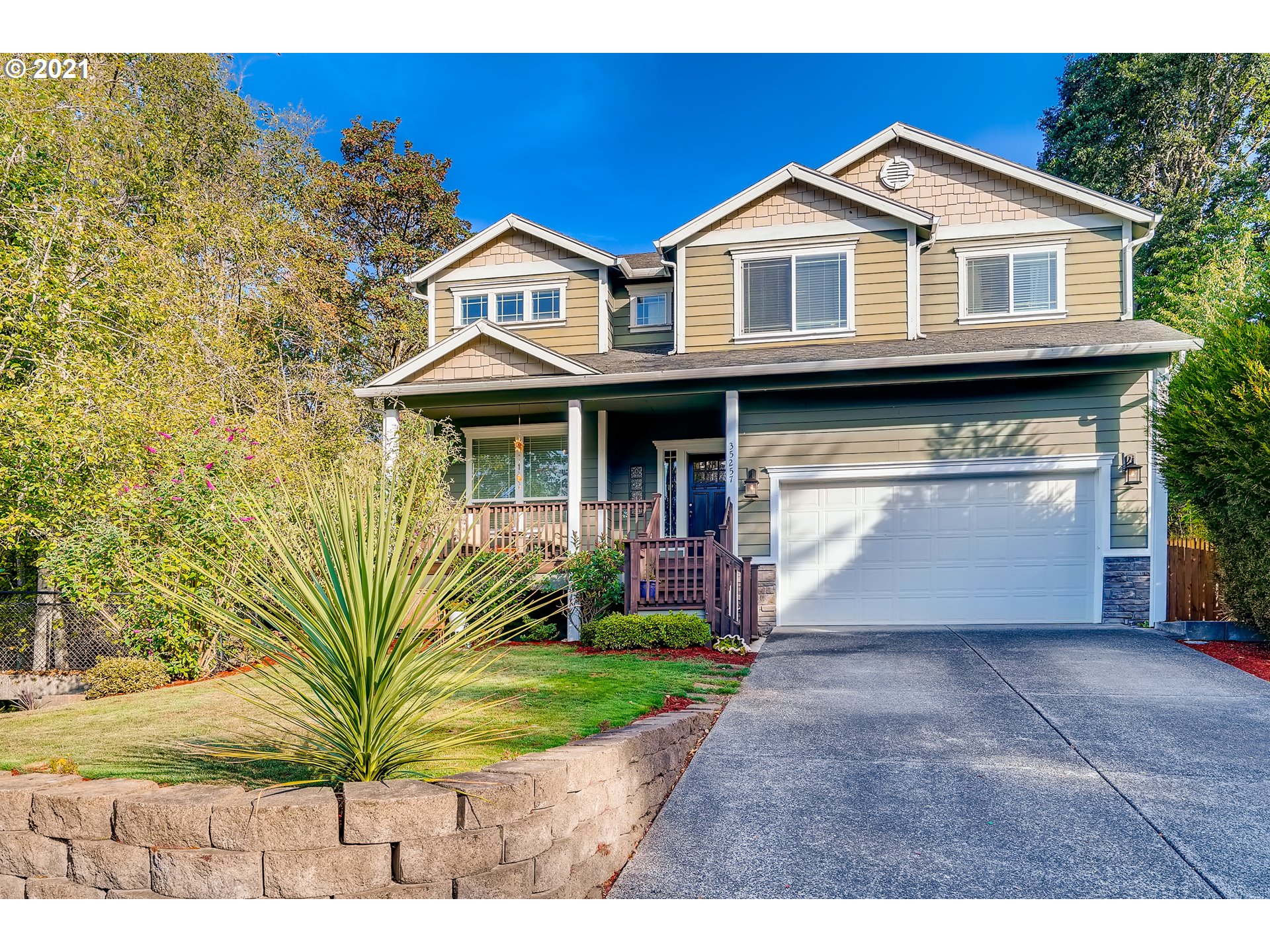 35257 Juniper Drive St. Helens, OR 97051 - Photo 2 of 27 a front view of a house with a garden and yard