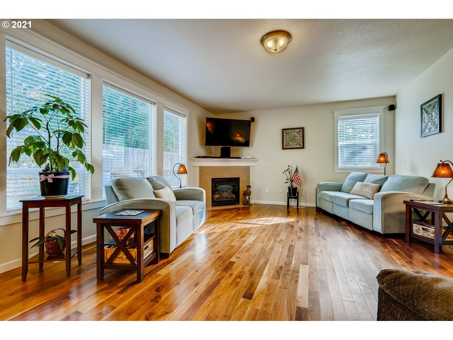 35257 Juniper Drive St. Helens, OR 97051 - Photo 6 of 27 a living room with furniture a fireplace and a flat screen tv