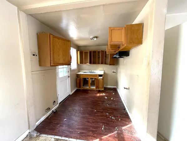 a kitchen with stainless steel appliances a refrigerator and a stove top oven
