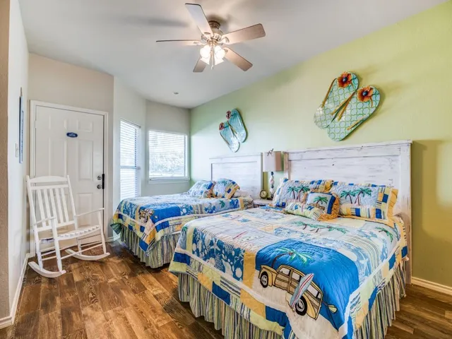 a bedroom with double bed and a window