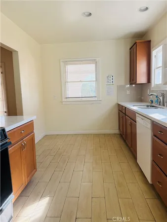 a view of a kitchen with a sink and a microwave