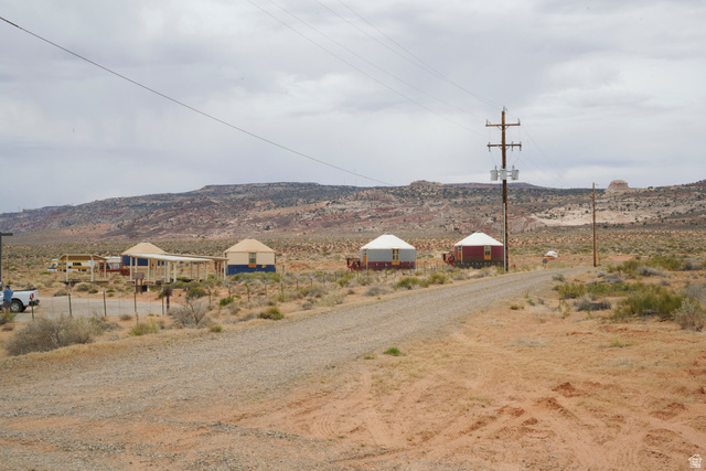 151 South Nomad Way Kanab, UT 84741 - Photo 5 of 40 View of mountain backdrop with rural landscape