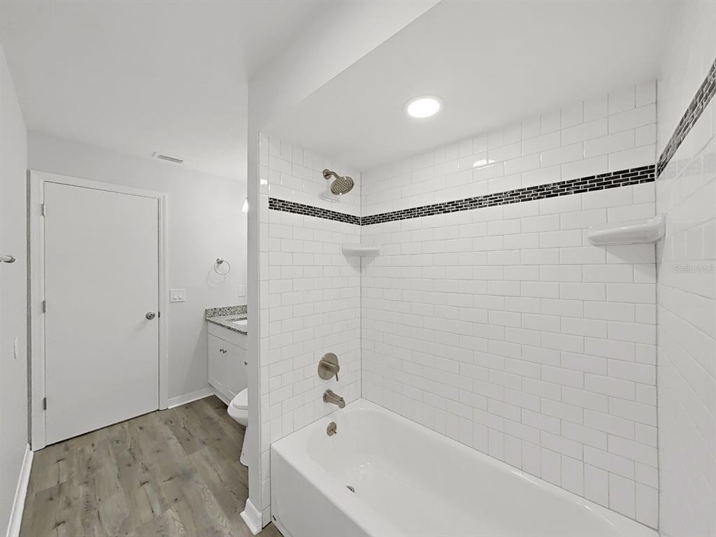 902 Great Pine Point Inverness, FL 34452 - Photo 28 of 39 a bathroom with a bathtub and a shower