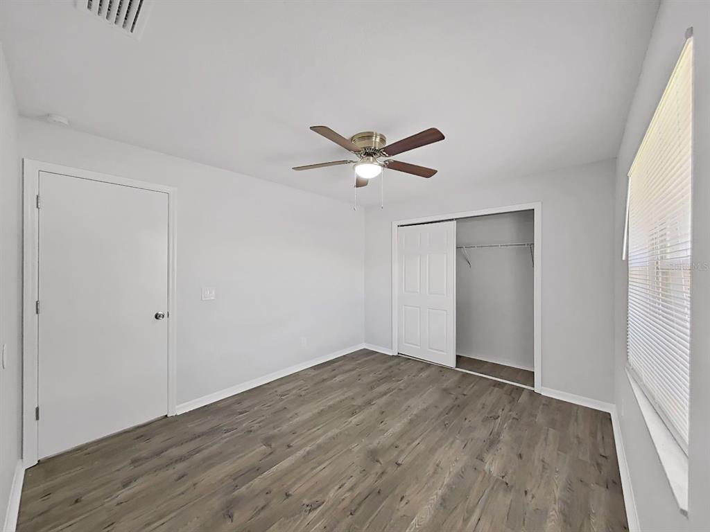 902 Great Pine Point Inverness, FL 34452 - Photo 30 of 39 a view of an empty room with wooden floor