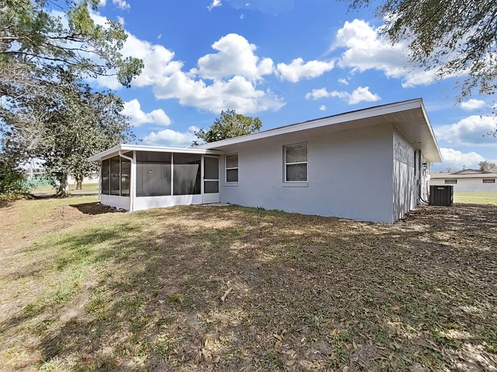 902 Great Pine Point Inverness, FL 34452 - Photo 37 of 39 a backyard of a house with table and chairs