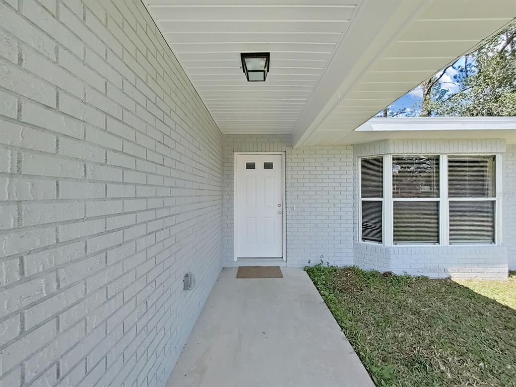 902 Great Pine Point Inverness, FL 34452 - Photo 5 of 39 a front view of a house with a yard