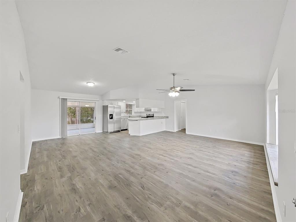 902 Great Pine Point Inverness, FL 34452 - Photo 6 of 39 a view of a hallway with wooden floor