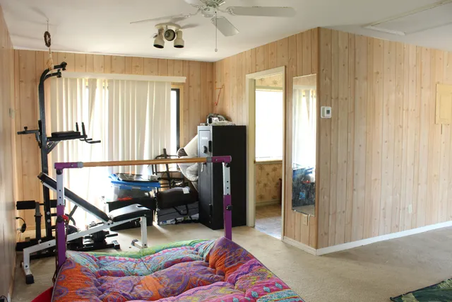 a bedroom with furniture and a window
