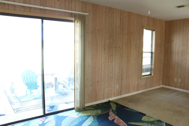 a view of an empty room and window