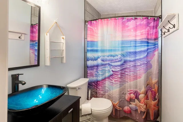 a bathroom with a sink and a toilet