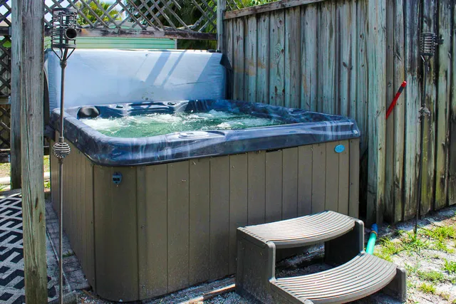 a wooden table with chairs