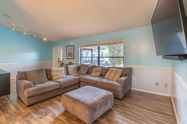 a living room with furniture and a window