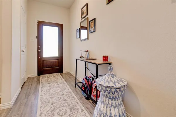 a view of a hallway with seating area