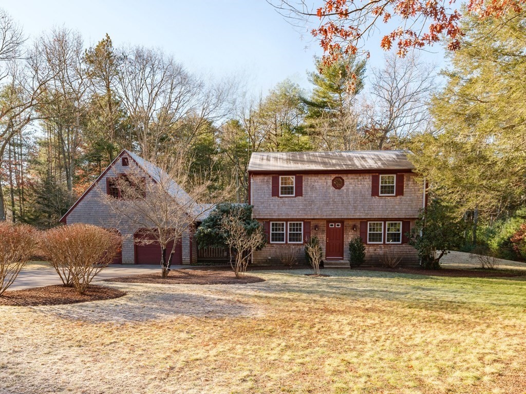 571 Main Street Marshfield, MA 02050 - Photo 1 of 25 a front view of a house with a yard and garage