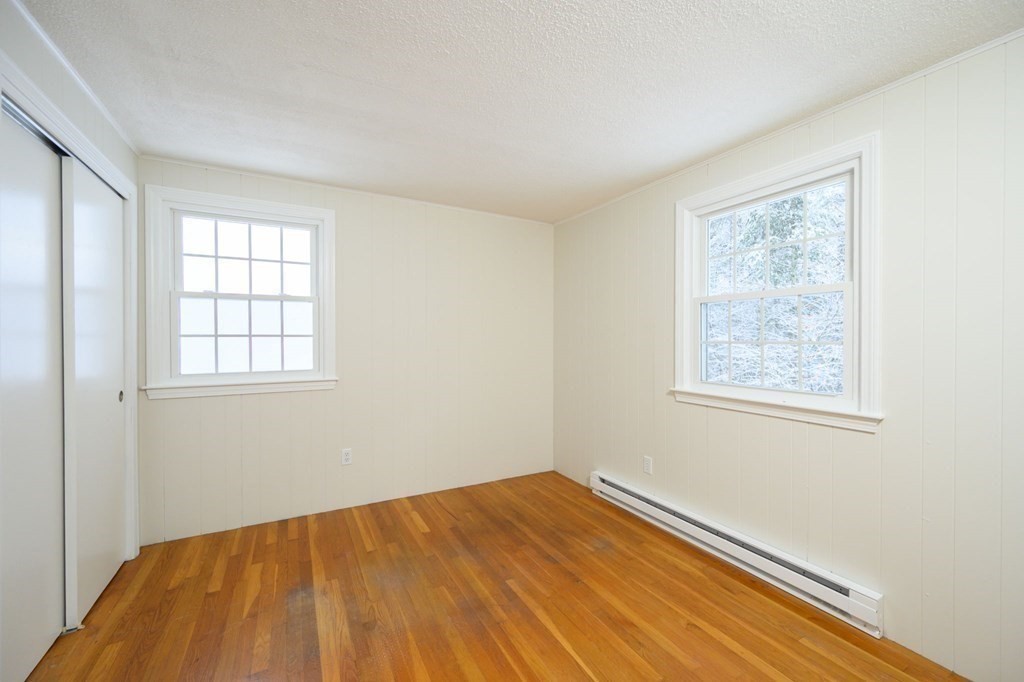 571 Main Street Marshfield, MA 02050 - Photo 14 of 25 a view of a room with wooden floor and windows