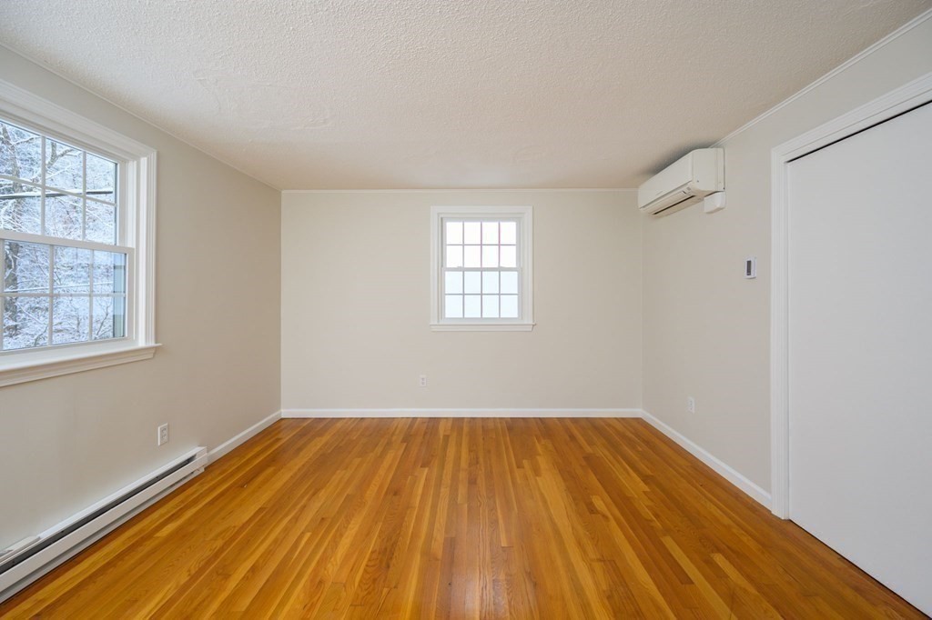 571 Main Street Marshfield, MA 02050 - Photo 15 of 25 a view of empty room with wooden floor and fan