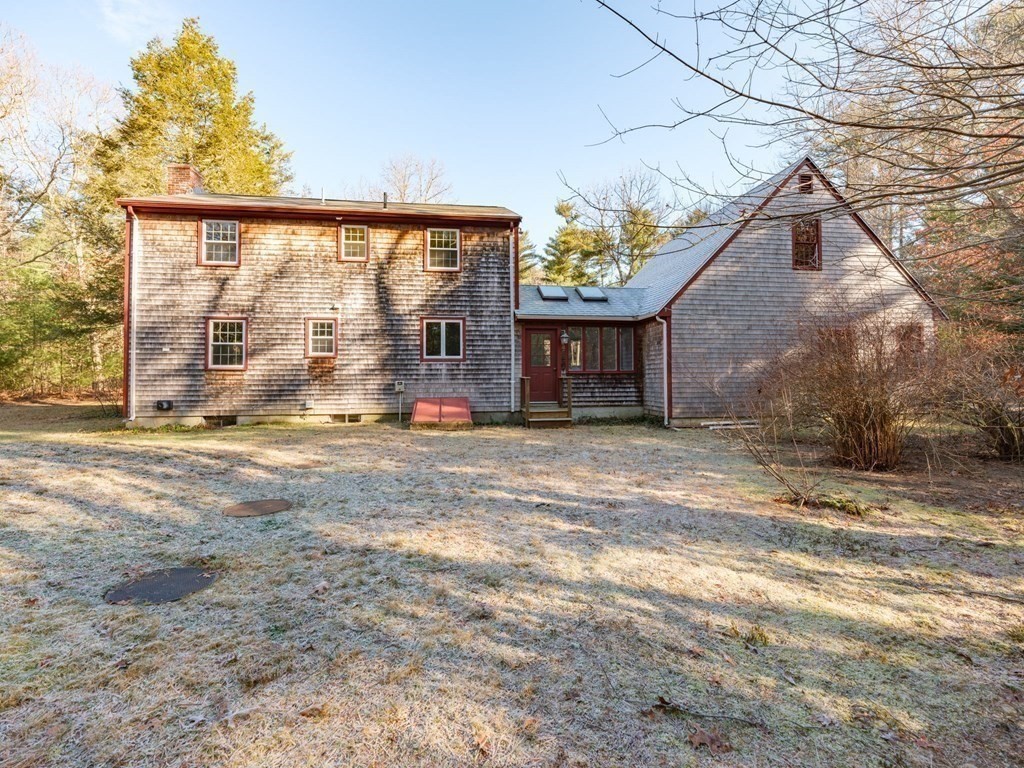 571 Main Street Marshfield, MA 02050 - Photo 24 of 25 a view of front door and yard with wooden fence