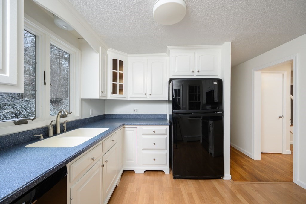 571 Main Street Marshfield, MA 02050 - Photo 5 of 25 a kitchen with a sink and a refrigerator