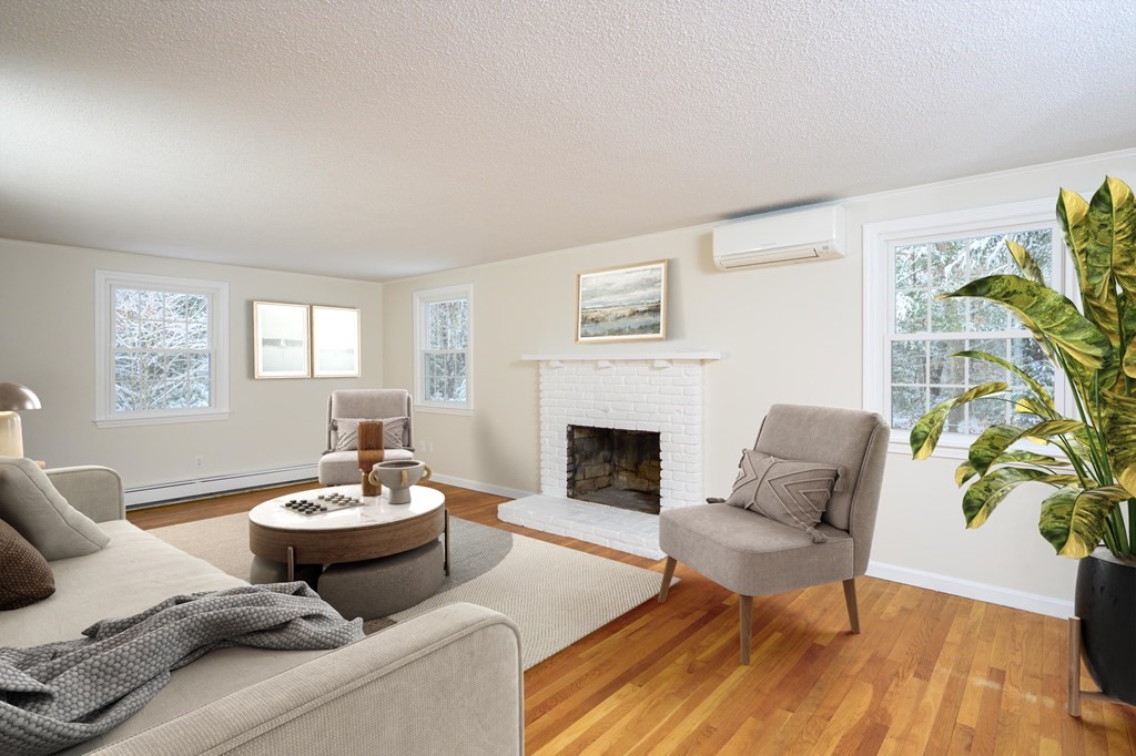 571 Main Street Marshfield, MA 02050 - Photo 10 of 25 a living room with furniture and a fireplace