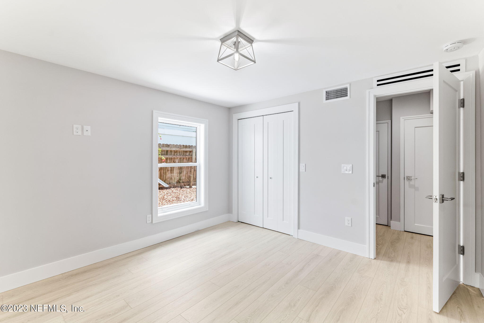 5348 Pelican Way St. Augustine, FL 32080 - Photo 12 of 58 a view of an empty room with a window