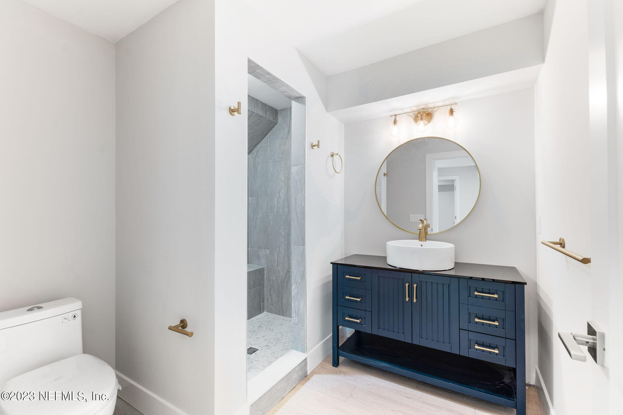 5348 Pelican Way St. Augustine, FL 32080 - Photo 13 of 58 a bathroom with a toilet a sink and a mirror