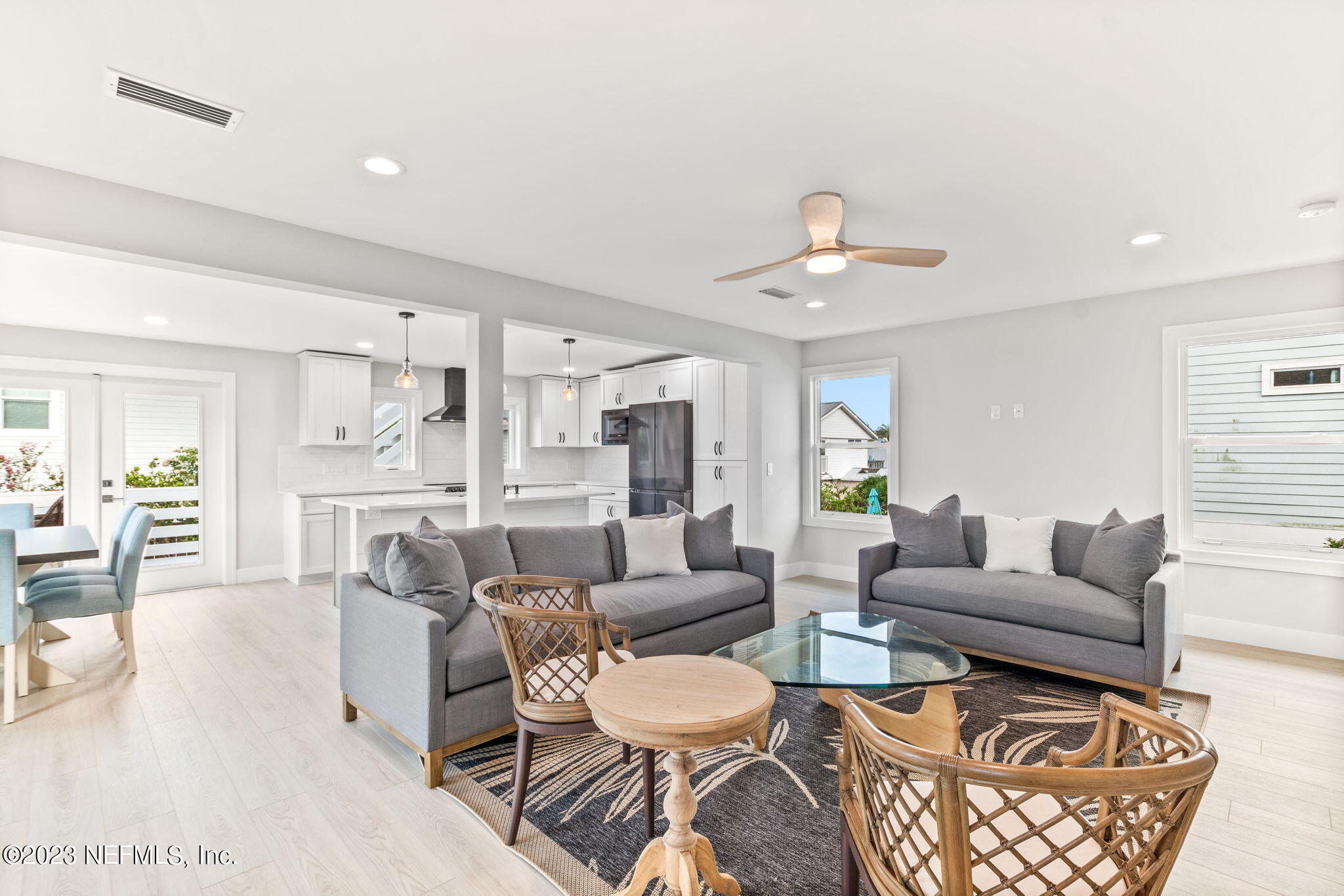 5348 Pelican Way St. Augustine, FL 32080 - Photo 19 of 58 a living room with furniture and a chandelier