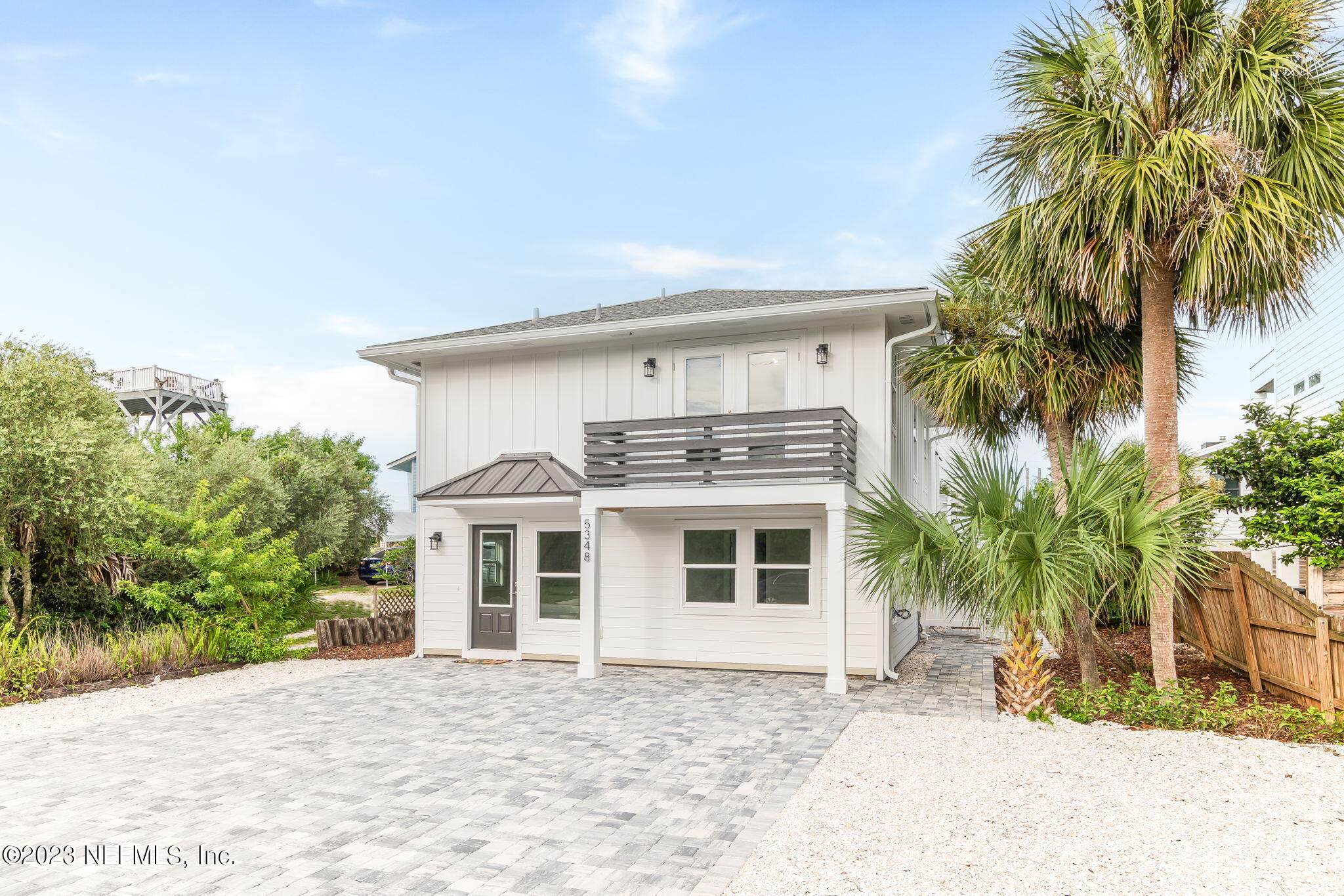 5348 Pelican Way St. Augustine, FL 32080 - Photo 2 of 58 a view of a house with a yard and potted plants